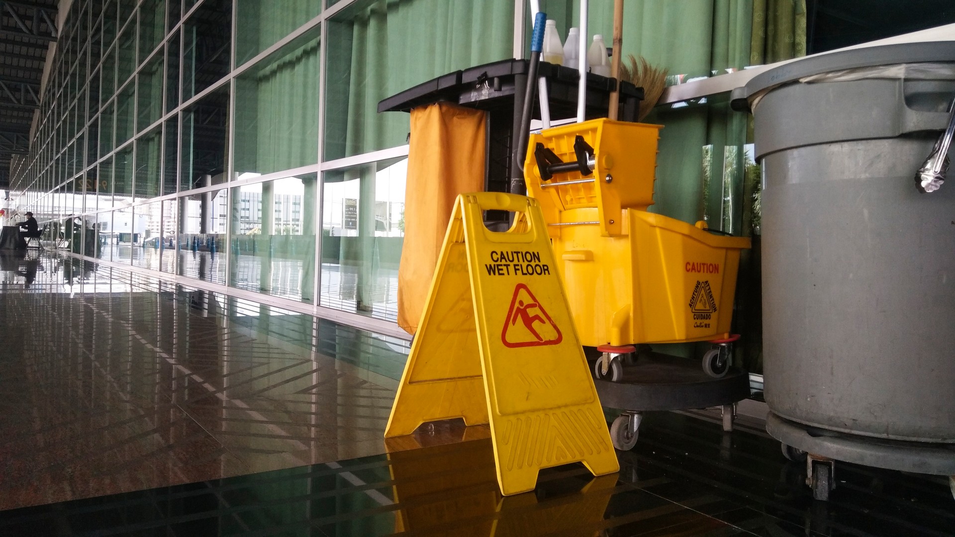 The warning signs cleaning and caution wet floor.