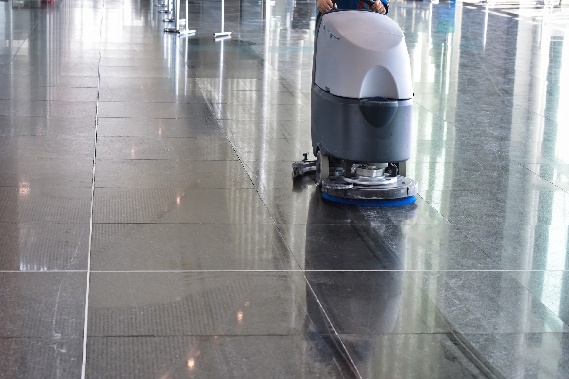 Floor Cleaning Machine on Reflective Tiles