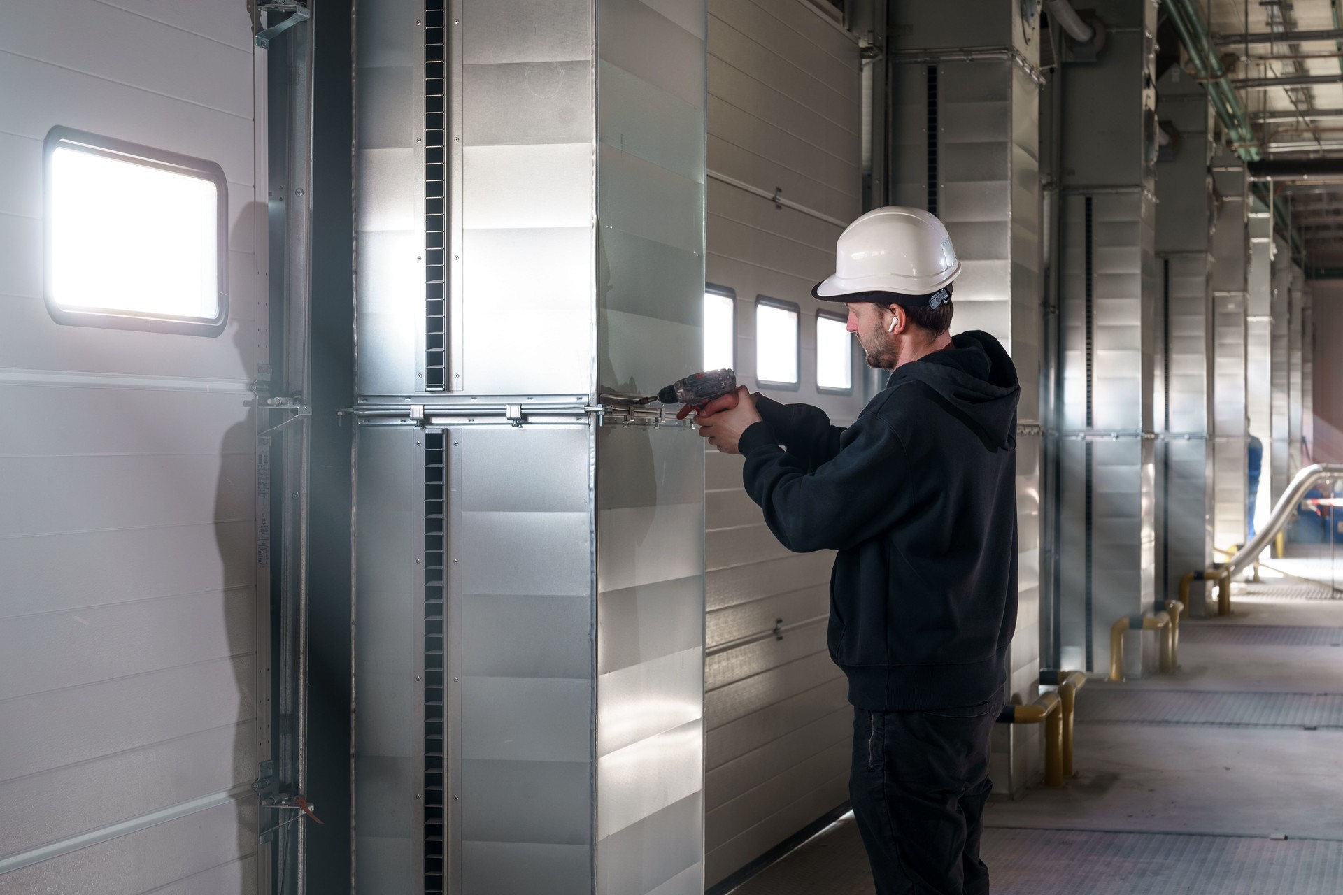 Engineer repairing an unloading gate